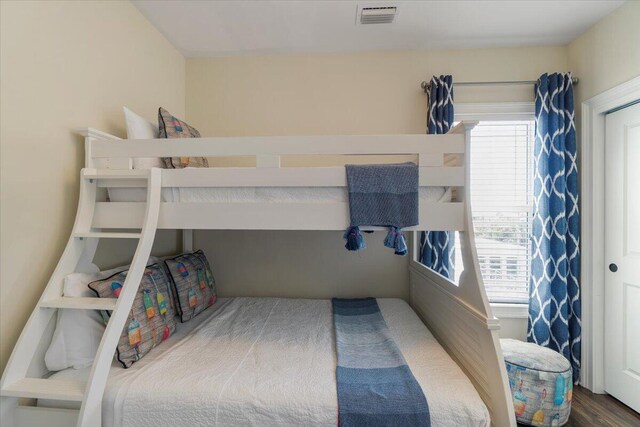 219 Sombrero Beach Rd Unit 2, Marathon, FL 33050 - bedroom featuring visible vents and wood finished floors