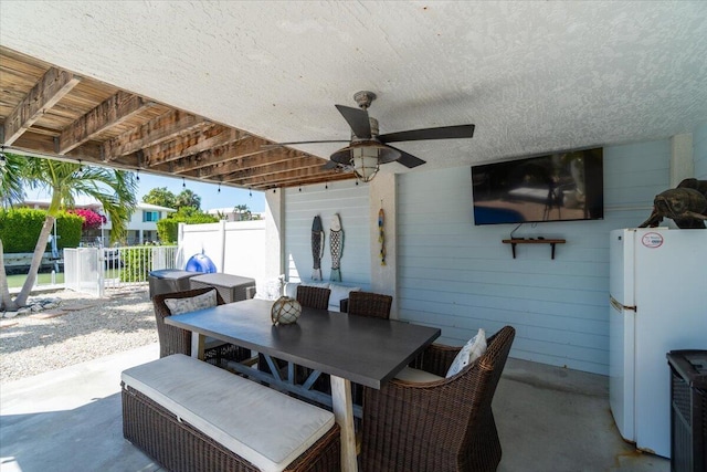 219 Sombrero Beach Rd Unit 2, Marathon, FL 33050 - view of patio / terrace featuring outdoor dining area, fence, and ceiling fan