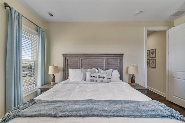 219 Sombrero Beach Rd Unit 2, Marathon, FL 33050 - bedroom featuring baseboards, visible vents, and wood finished floors