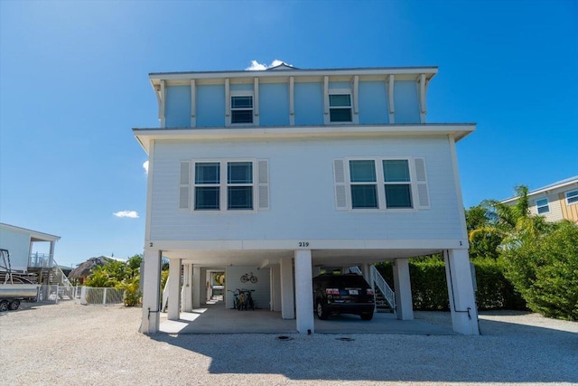 219 Sombrero Beach Rd Unit 2, Marathon, FL 33050 - beach home featuring gravel driveway, stairway, and a carport