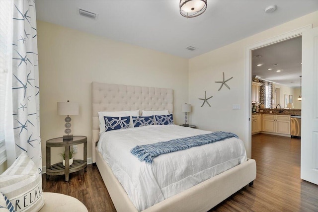 219 Sombrero Beach Rd Unit 2, Marathon, FL 33050 - bedroom featuring a sink, dark wood-style floors, and visible vents