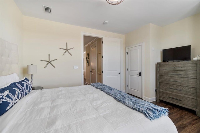 219 Sombrero Beach Rd Unit 2, Marathon, FL 33050 - bedroom with visible vents, baseboards, and wood finished floors