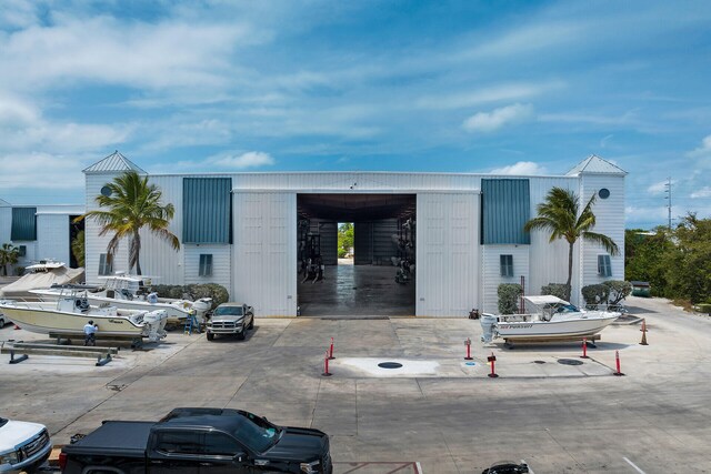 1133 Ocean Dr Unit 4, Marathon, FL 33050 - view of property with uncovered parking and an outbuilding