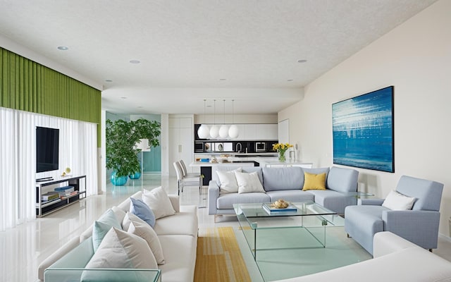 living area featuring a textured ceiling