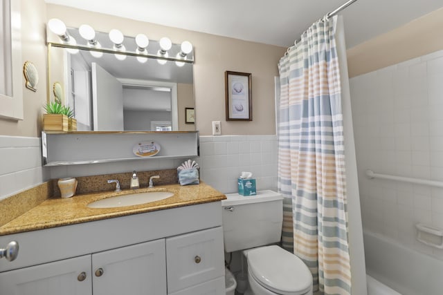 1101 Ocean Dr Unit 29, Key Colony, FL 33051 - bathroom featuring vanity, shower / bath combination with curtain, wainscoting, and tile walls