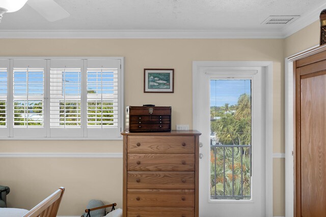 interior space with visible vents and ornamental molding