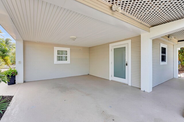 view of patio / terrace featuring an attached carport