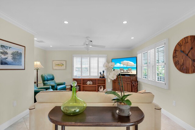 living area with light tile patterned floors, baseboards, ornamental molding, and recessed lighting