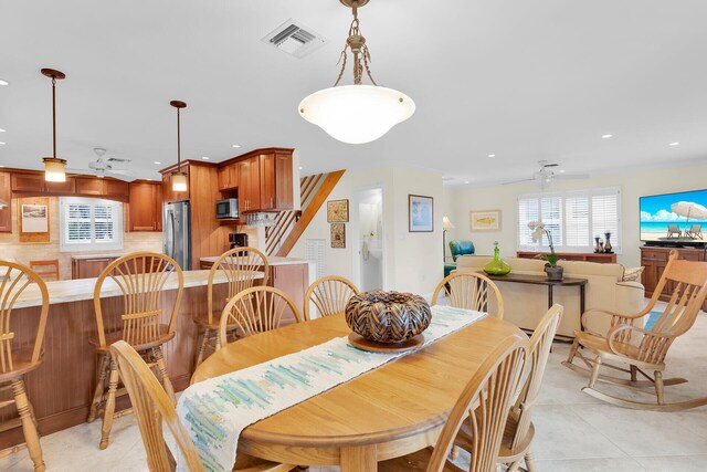 dining space featuring light tile patterned floors, visible vents, and recessed lighting