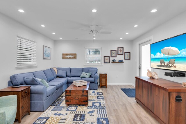 living area with recessed lighting, baseboards, a ceiling fan, and light wood finished floors