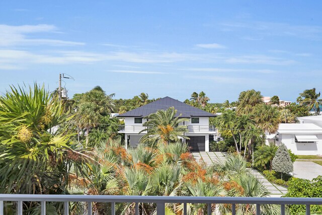 view of front of home featuring a balcony