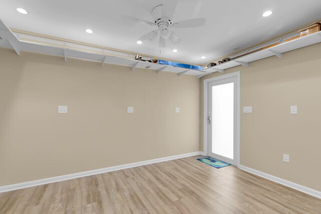 garage featuring a ceiling fan, recessed lighting, and baseboards