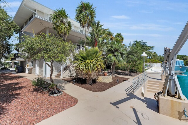 exterior space with stairway and driveway