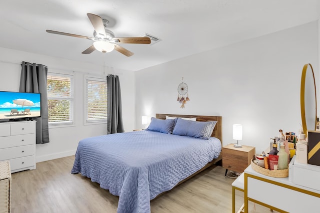 111 Stirrup Key Woods Rd Unit 2B1, Marathon, FL 33050 - bedroom with light wood finished floors, a ceiling fan, and baseboards
