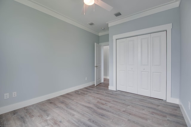 335 Pirates Rd, Little Torch, FL 33042 - unfurnished bedroom with ornamental molding, wood finished floors, a closet, and a ceiling fan