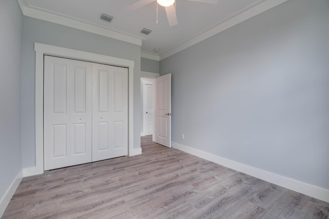 335 Pirates Rd, Little Torch, FL 33042 - unfurnished bedroom featuring crown molding, a closet, wood finished floors, and ceiling fan