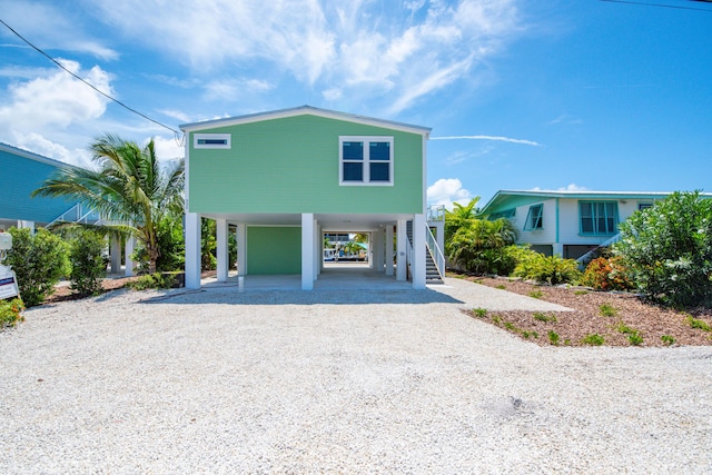 335 Pirates Rd, Little Torch, FL 33042 - view of front of property featuring a carport, stairs, and driveway