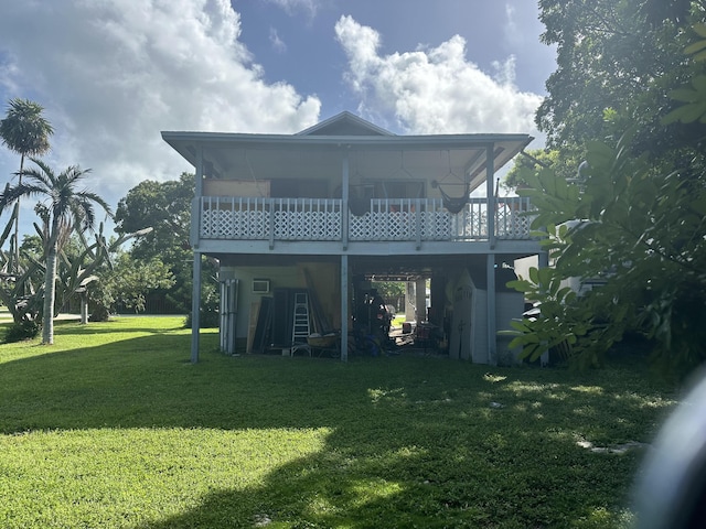 rear view of property featuring a yard