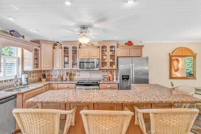 30985 Hibiscus Dr, Big Pine, FL 33043 - kitchen featuring stainless steel appliances, a kitchen breakfast bar, glass insert cabinets, a center island, and recessed lighting
