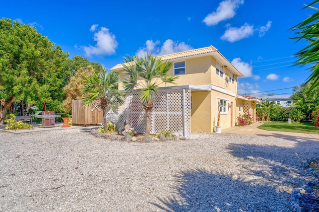 30985 Hibiscus Dr, Big Pine, FL 33043 - view of front of home featuring stucco siding and a tiled roof