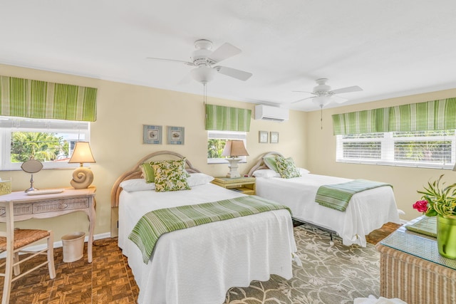 30985 Hibiscus Dr, Big Pine, FL 33043 - bedroom featuring a wall mounted air conditioner, multiple windows, and a ceiling fan