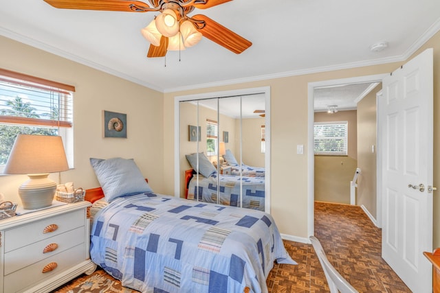 30985 Hibiscus Dr, Big Pine, FL 33043 - bedroom with a closet, ornamental molding, and ceiling fan