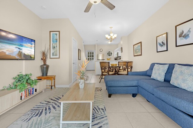 5081 Sunset Village Dr, Duck, FL 33050 - living area featuring light tile patterned flooring, a chandelier, ceiling fan, and baseboards