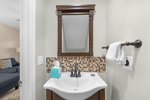 5081 Sunset Village Dr, Duck, FL 33050 - bathroom featuring decorative backsplash and vanity