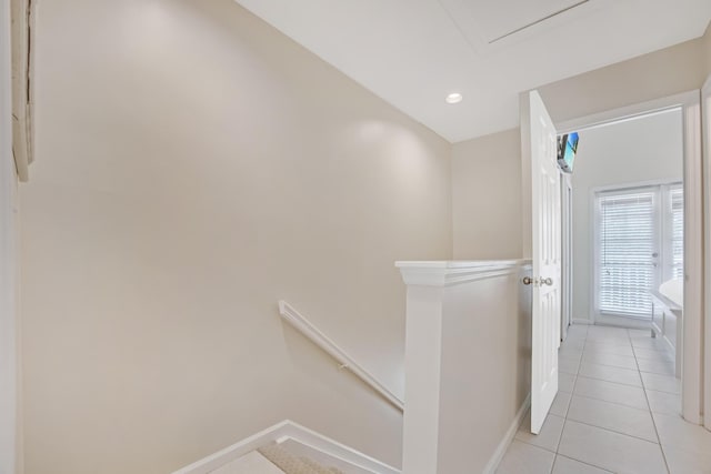 5081 Sunset Village Dr, Duck, FL 33050 - hallway with an upstairs landing, baseboards, light tile patterned floors, and recessed lighting