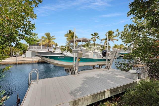 437 Pirates Rd, Little Torch, FL 33042 - dock featuring boat lift, a water view, and central air condition unit