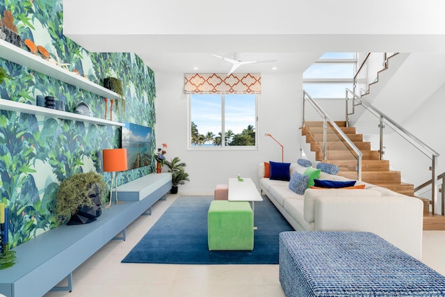 living area with stairway and healthy amount of natural light