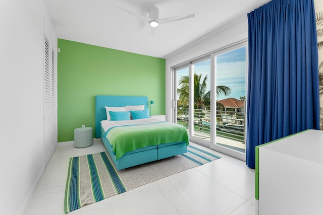bedroom featuring access to exterior and a ceiling fan