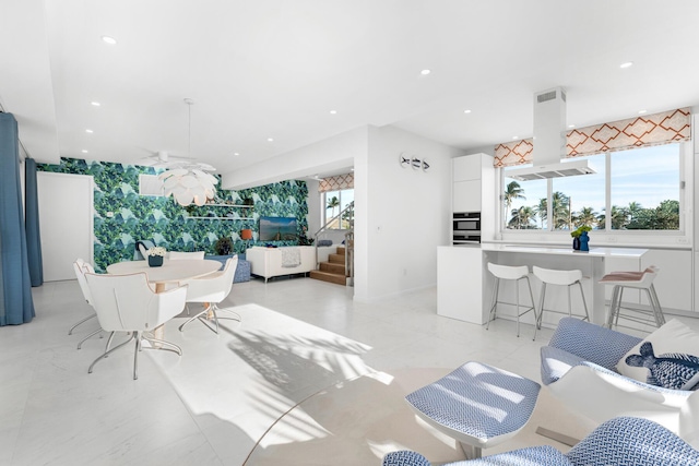 dining area with ceiling fan and recessed lighting