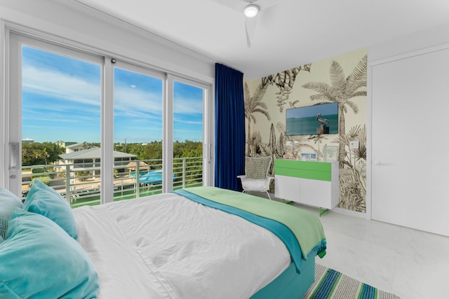 bedroom featuring wallpapered walls, multiple windows, and a ceiling fan