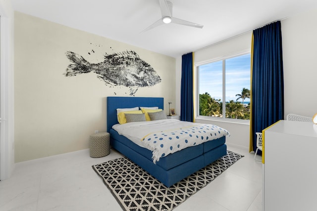 bedroom featuring ceiling fan and baseboards