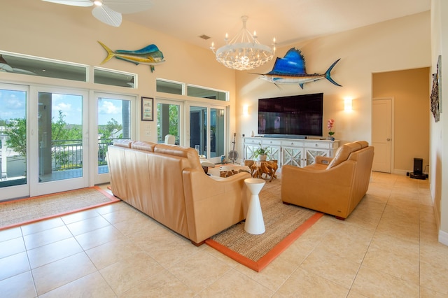 living room with a high ceiling, light tile patterned floors, and visible vents