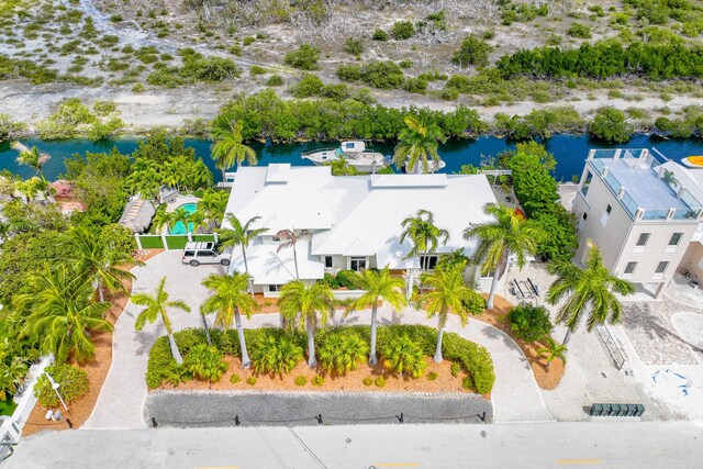 birds eye view of property featuring a water view and a residential view