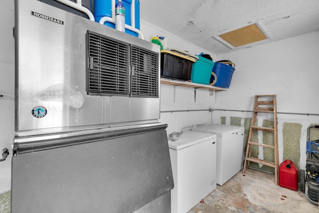 389 Anglers Dr Unit 105, Marathon, FL 33050 - washroom with washer and clothes dryer and a textured ceiling