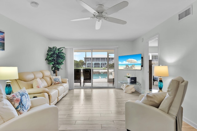 389 Anglers Dr Unit 105, Marathon, FL 33050 - living area with ceiling fan and wood finished floors