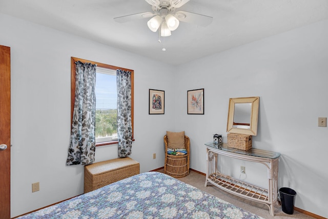 carpeted bedroom featuring ceiling fan and baseboards