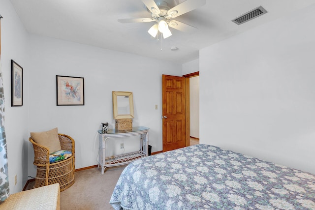 carpeted bedroom featuring visible vents, baseboards, and ceiling fan