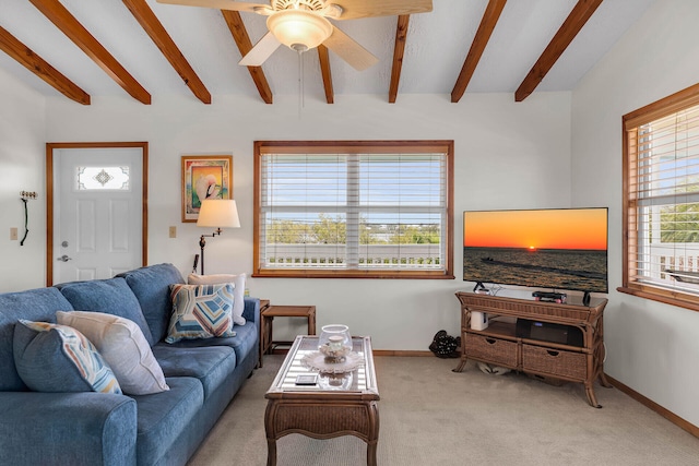 living room featuring beam ceiling, carpet, and baseboards