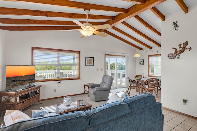 living room with baseboards, a ceiling fan, light tile patterned flooring, and vaulted ceiling with beams