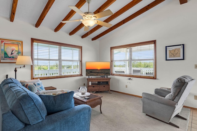 carpeted living area with baseboards, plenty of natural light, and vaulted ceiling with beams