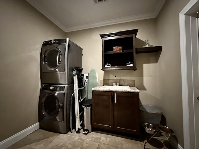 19749 Date Palm Dr, Sugarloaf, FL 33042 - laundry area with a sink, stacked washing maching and dryer, crown molding, and cabinet space