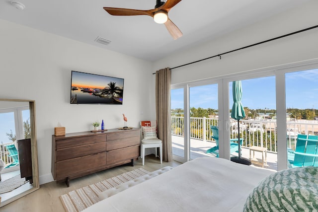 bedroom featuring light wood-style flooring, visible vents, access to exterior, and ceiling fan