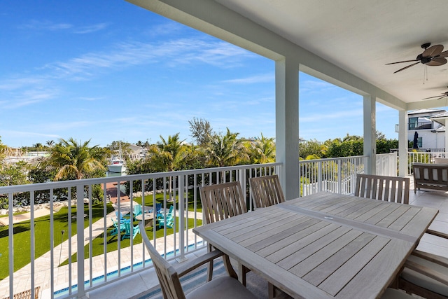 balcony with ceiling fan and outdoor dining area