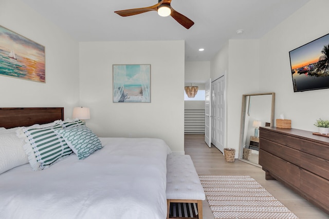 bedroom with recessed lighting, light wood finished floors, a closet, and ceiling fan