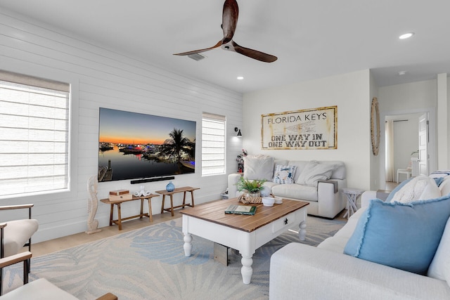 living room with visible vents, ceiling fan, recessed lighting, and wood finished floors
