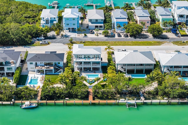 birds eye view of property featuring a residential view and a water view